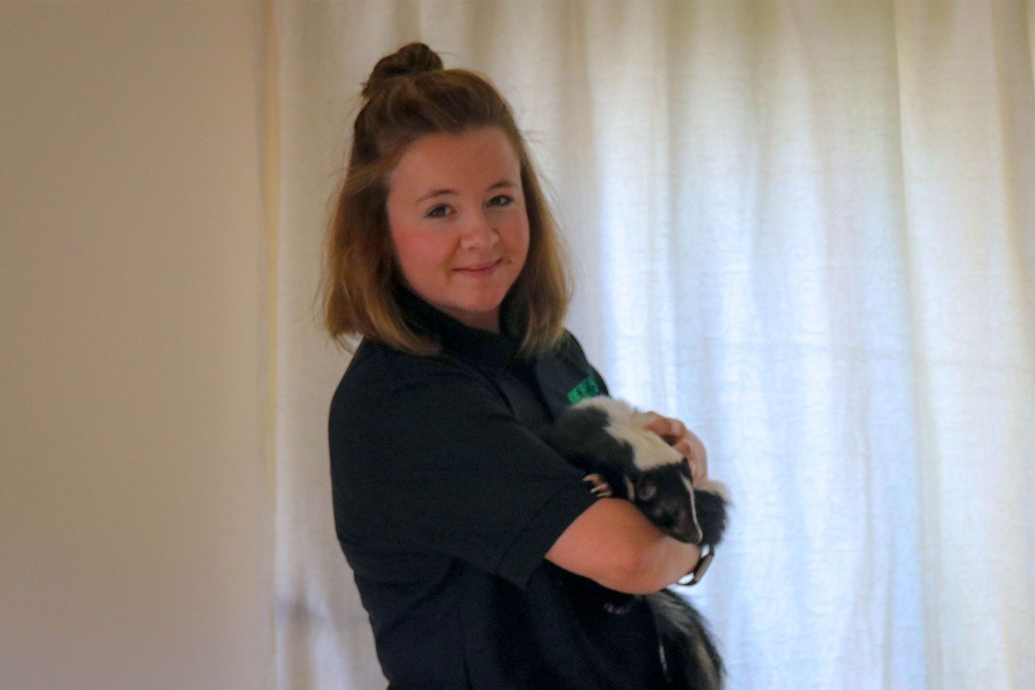 Amanda holding one of our skunks Amanda holding one of our skunks